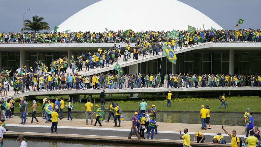 FILE - Protesters, supporters of Brazil&#039;s former President Jair Bolsonaro, storm the the National Congress building in Brasilia, Brazil, Jan. 8, 2023. Brazil?s federal police searched the home of ...