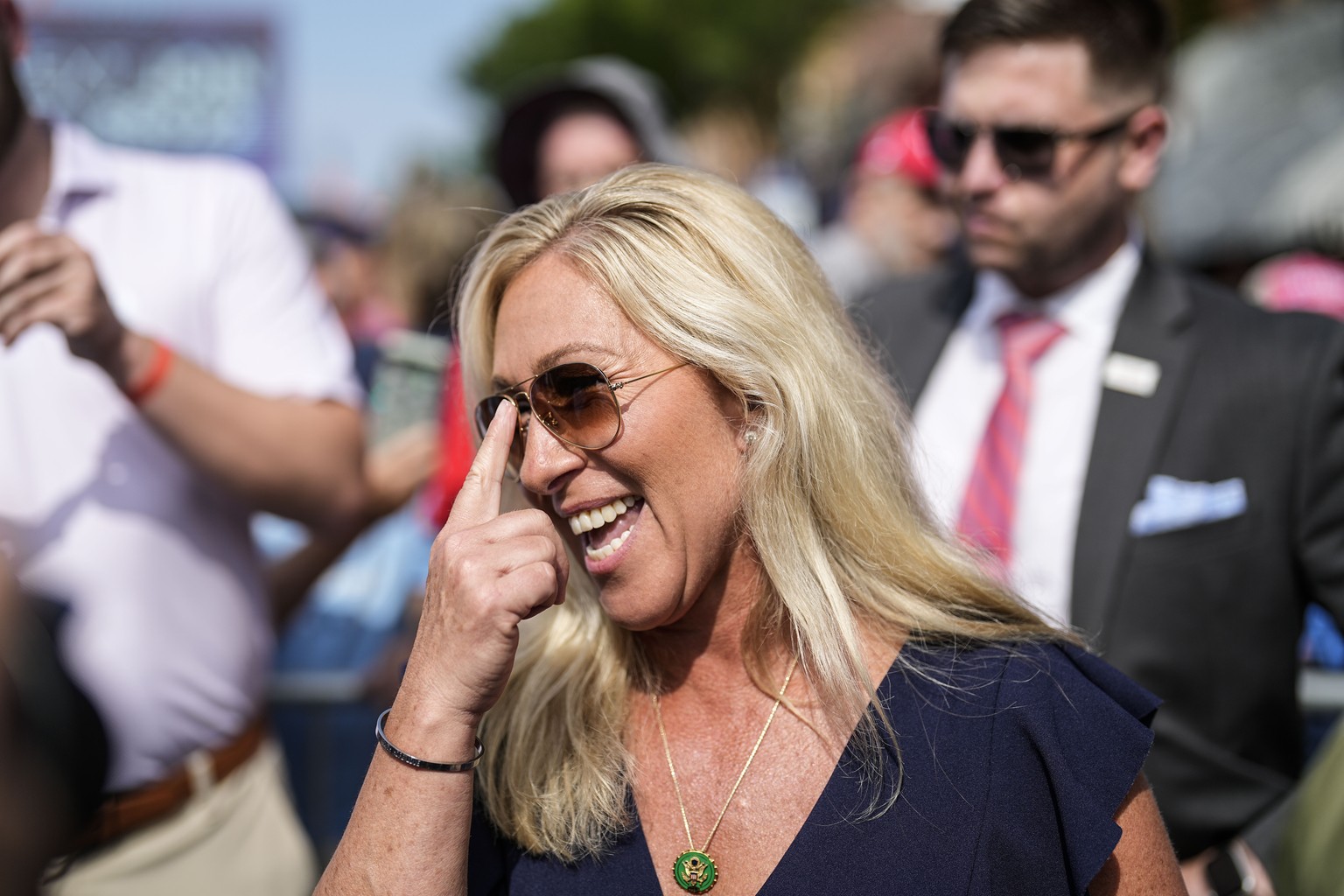 FILE - Rep. Marjorie Taylor Greene speaks to people before former President Donald Trump speaks during a rally, Saturday, July 1, 2023, in Pickens, S.C. On Friday, July 14, The Associated Press report ...