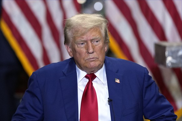 Republican presidential nominee former President Donald Trump listens at a business roundtable discussion at a campaign event at Precision Components Group, Monday, Aug. 19, 2024, in York, Pa. (AP Pho ...