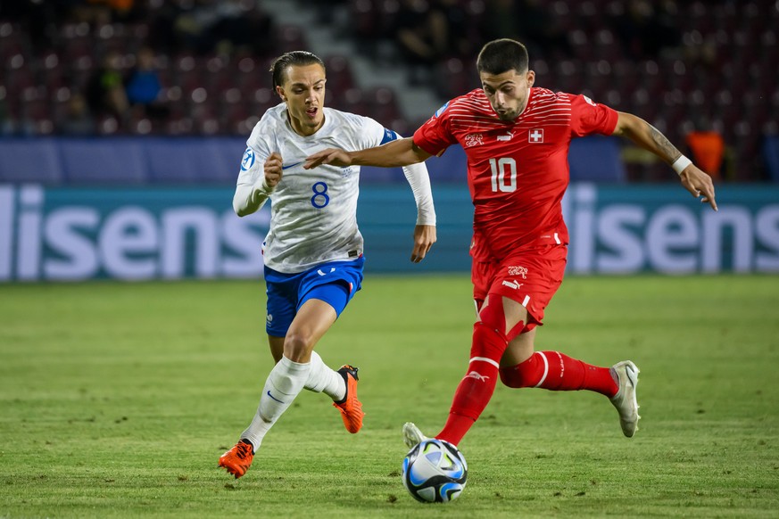 France&#039;s Maxence Caqueret, left, in action against Switzerland&#039;s Kastriot Imeri, right, during a Group D match between Switzerland and France at the 2023 UEFA European Under-21 Championship  ...