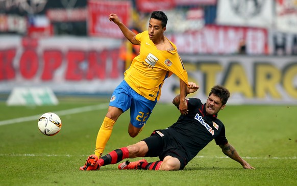 BRAUNSCHWEIG, GERMANY - OCTOBER 04: Salim Khelifi (L) of Braunschweig challenges for the ball with Dennis Daube of Union Berlin during the Second Bundesliga match between Eintracht Braunschweig and 1. ...