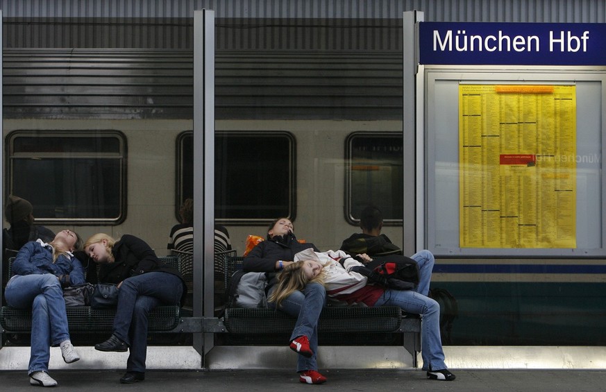 Train passengers sleep on a platform of the main station in Munich on Friday, October 5, 2007. The train drivers' union (GDL) had called the train drivers for a three-hour...