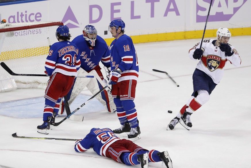 Florida Panthers center Aleksander Barkov (16) turns to celebrate with teammates after the go-ahead goal was scored against the New York Rangers by center Denis Malgin during the third period of an NH ...