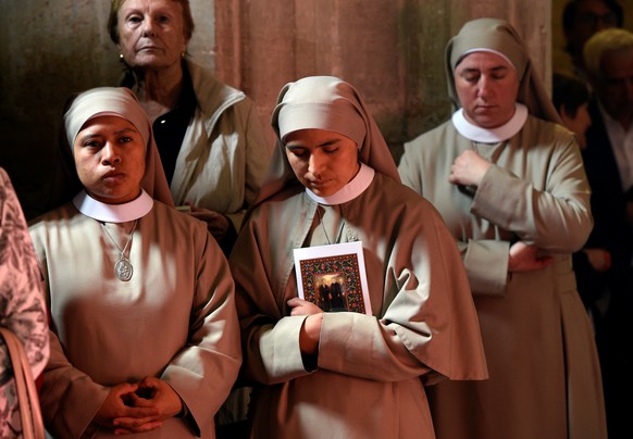 Three nuns attend a mass beatification of Antonio Gonzalez Alonso, Isidoro Fernandez Cordero, Genaro Fueyo Castanon y Segundo Alonso Gonzalez, known as the martyrs of Nembra, who were killed during th ...