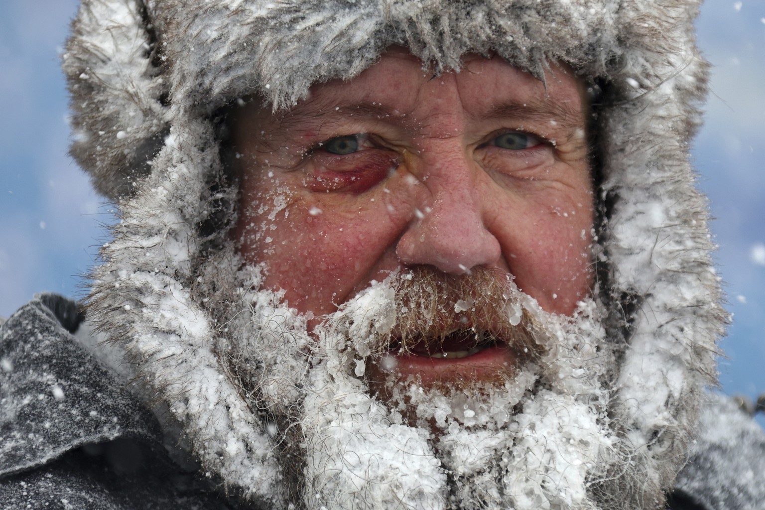 A worker pauses while removing snow from Highmark Stadium in Orchard Park, N.Y., Sunday Jan. 14, 2024. A potentially dangerous snowstorm that hit the Buffalo region on Saturday led the NFL to push bac ...