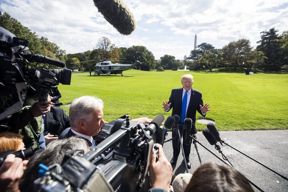 epa06288903 US President Donald J. Trump speaks to the media as he departs the White House for a fundraiser in Dallas, Texas, on the South Lawn of the White House in Washington, DC, USA, 25 October 20 ...