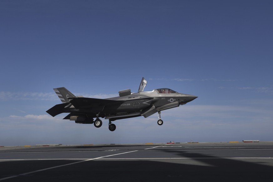 A pilot maneuvers an F-35 jet as military personnel participate in the NATO Steadfast Defender 2021 exercise on the aircraft carrier HMS Queen Elizabeth off the coast of Portugal, Thursday, May 27, 20 ...