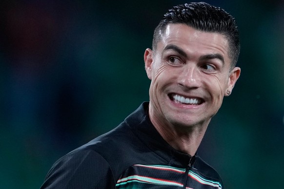 Portugal&#039;s Cristiano Ronaldo smiles as he warms up for a World Cup 2026 group F qualifying soccer match between Portugal and Hungary in Lisbon, Tuesday, Oct. 14, 2025. (AP Photo/Armando Franca)
A ...