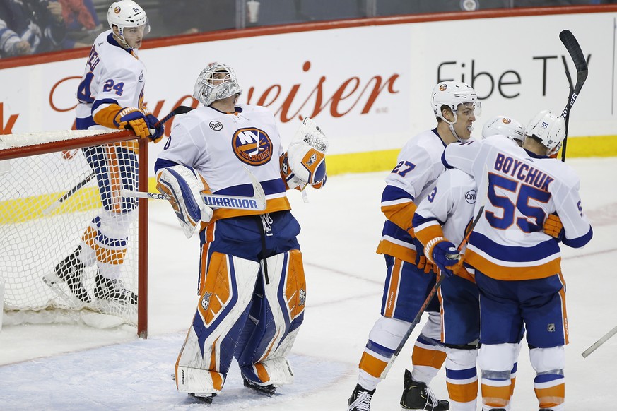 New York Islanders goaltender Robin Lehner (40) celebrates after the Islanders defeated the Winnipeg Jets in an NHL hockey game Thursday, March 28, 2019, in Winnipeg, Manitoba. (John Woods/The Canadia ...