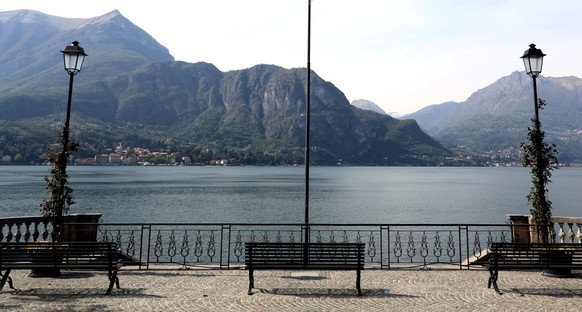 epa08361179 The lakefront deserted due to traffic restrictions imposed due to the emergence of the coronavirus in Bellagio, Lake Como, Italy, 13 December 2020. EPA/MATTEO BAZZI