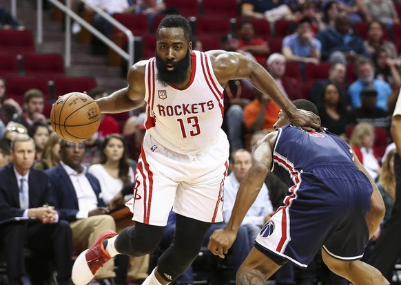 Jan 2, 2017; Houston, TX, USA; Houston Rockets guard James Harden (13) drives to the basket as Washington Wizards guard Bradley Beal (3) defends during the first quarter at Toyota Center. Mandatory Cr ...