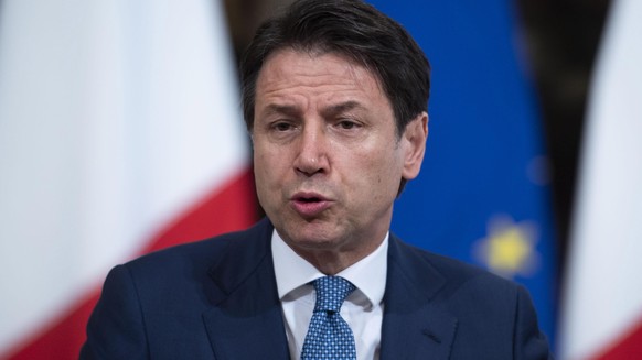 epa07753355 Italy&#039;s premier Giuseppe Conte attends a press conference prior to a working lunch with President-elect of the European Commission Ursula von der Leyen (not pictured) at Chigi Palace  ...