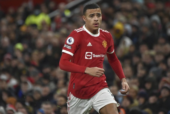 FILE- Manchester United&#039;s Mason Greenwood runs during the English Premier League soccer match between Manchester United and Burnley at Old Trafford in Manchester, England, Thursday, Dec. 30, 2021 ...