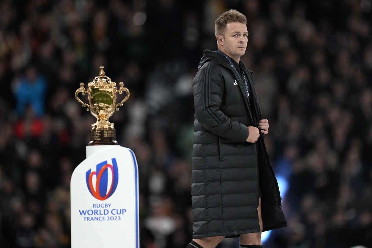New Zealand's Sam Cane walks past the trophy during presentation ceremony after the Rugby World Cup final match between New Zealand and South Africa at the Stade de France in Saint-Denis, near Pa ...
