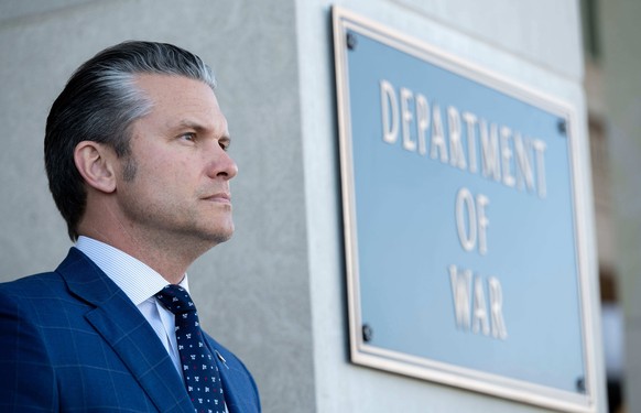 FILE - Defense Secretary Pete Hegseth stands outside the Pentagon during a welcome ceremony for the Japanese defense minister at the Pentagon in Washington, Jan. 15, 2026. (AP Photo/Kevin Wolf, File)
 ...