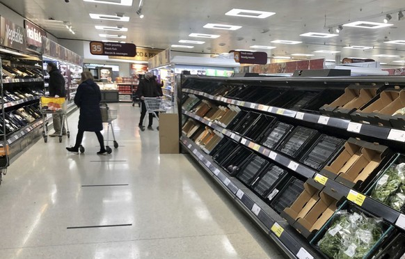 Depleted shelves are seen in a Sainsbury&#039;s supermarket at the Forestside shopping centre in Belfast, Monday, Jan. 11, 2021. The U.K.���s biggest supermarket chains warned Wednesday, Jan. 13 that  ...