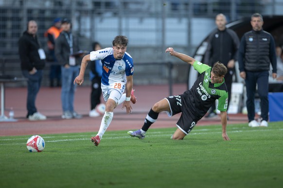From left, Simone Stroscio (GC), Kevin Behrens (LUG), during the Super League soccer match FC Lugano against Grasshopper Club ZUErich, at the Cornaredo Stadium in Lugano, Saturday, 27 September, 2025. ...