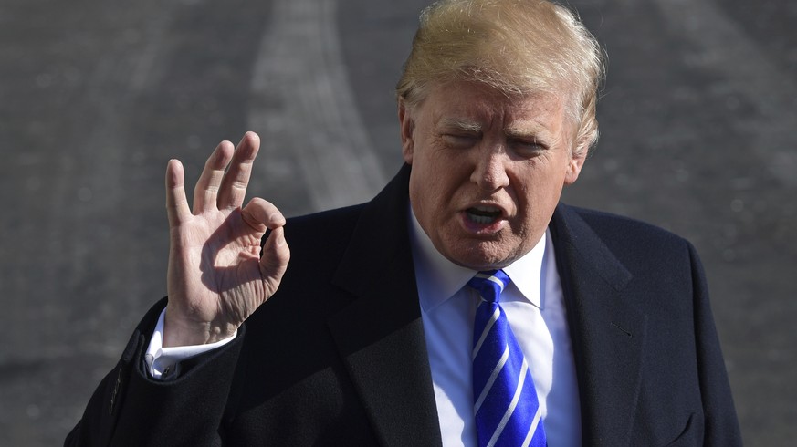 President Donald Trump talks with reporters as he departs from the South Lawn of the White House via Marine One in Washington, Saturday, Dec. 16, 2017, to spend the weekend at Camp David in Maryland.  ...