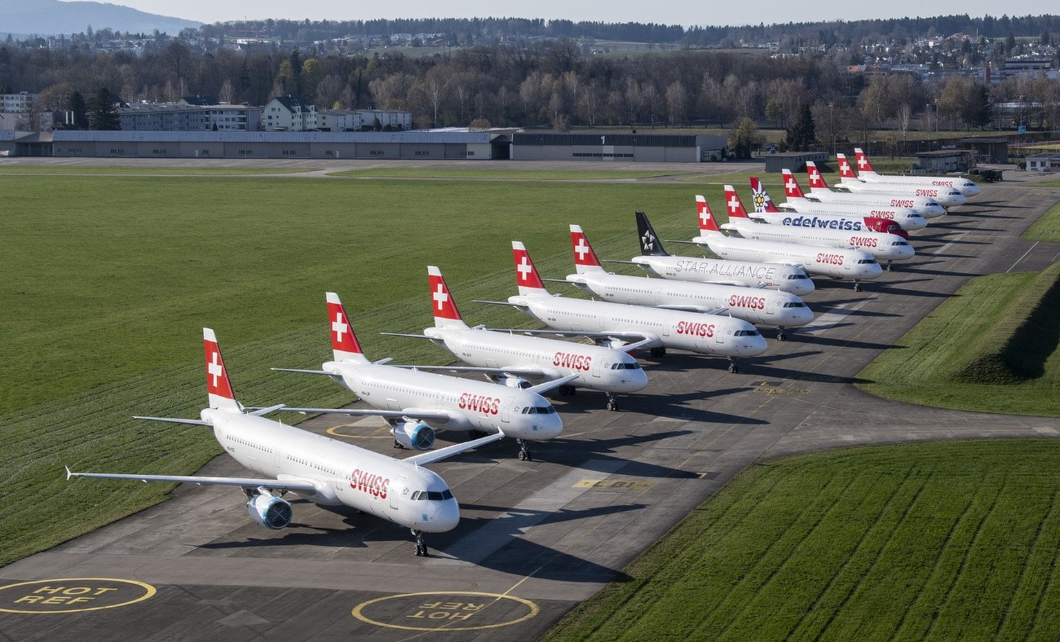 Parked planes of the airline Swiss at the airport in Duebendorf, Switzerland on Monday, 23 March 2020. The bigger part of the Swiss airplanes are not in use due to the outbreak of the coronavirus. (KE ...