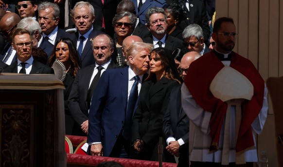 epa12056105 US President Donald Trump (C-L) and First Lady Melania (C-R) attend the funeral Mass of Pope Francis in Saint Peter&#039;s Square, Vatican City, 26 April 2025. Pope Francis passed away on  ...