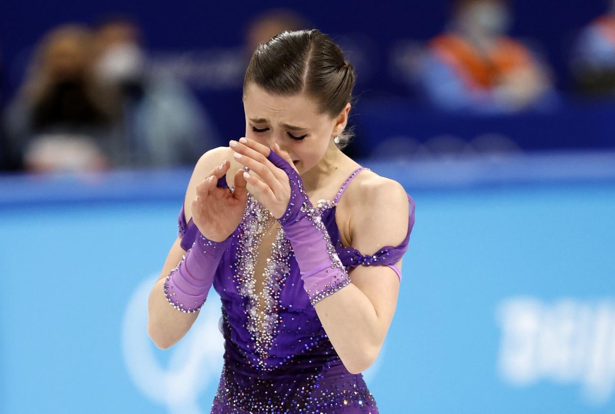 epa09759494 Kamila Valieva of Russia reacts before the Women's Short Program of the Figure Skating events at the Beijing 2022 Olympic Games, Beijing, China, 15 February 2022. EPA/HOW HWEE YOUNG