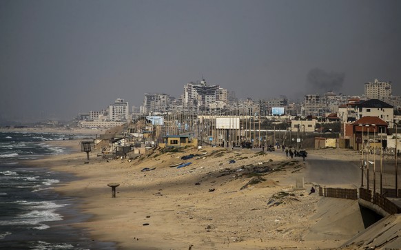 epa11234156 Smoke rises in the background following an Israeli air strike in Gaza City, northern Gaza Strip, 21 March 2024. More than 31,500 Palestinians and over 1,300 Israelis have been killed, acco ...