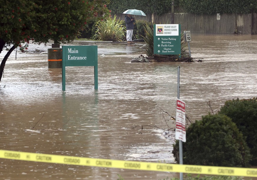 The parking lot at the Towers in Watsonville, Calif., is inundated by the water from Corralitos Creek during heavy storms on Monday, Jan. 9, 2023. The Towers, located on Green Valley Road at Holohan R ...