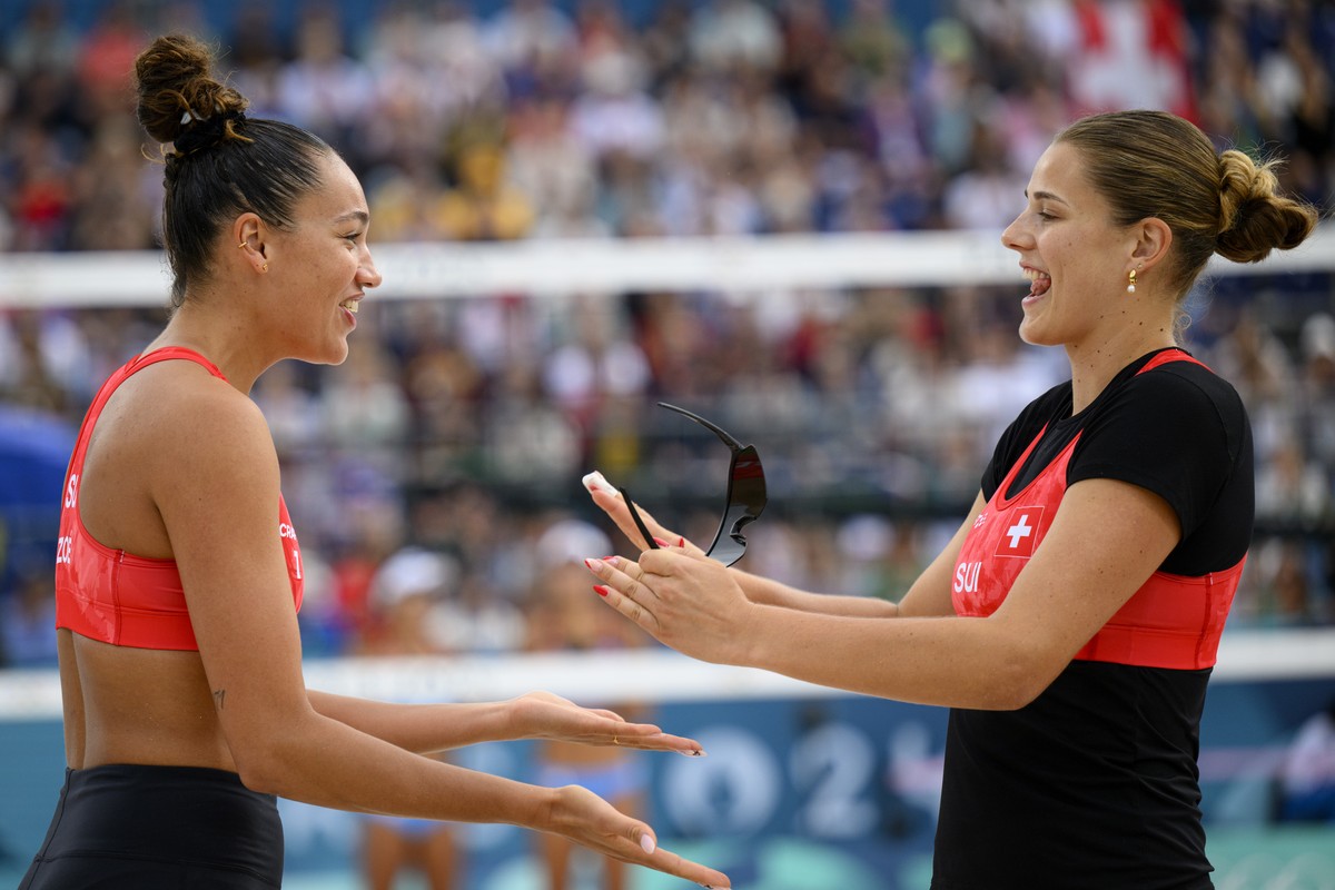 Switzerland's Esmee Boebner, right, and Zoe Verge-Depre, left, celebrates a point during the games against China's Xue Chen and Xia Xinyi during the women's beach volleyball round of 16 ...