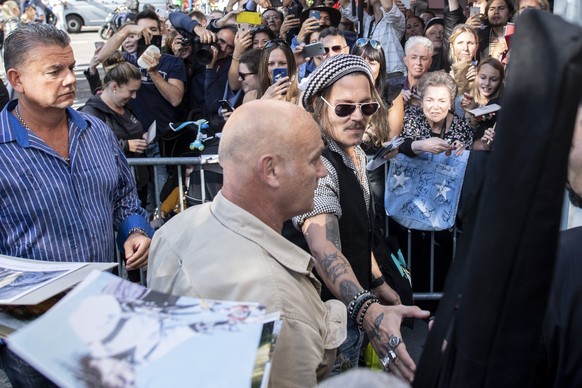 American actor Johnny Depp on his way to the podium &quot;a conversation with..&quot; during the 14th Zurich Film Festival (ZFF) in Zurich, Switzerland, Friday, October 05, 2018. The festival runs fro ...