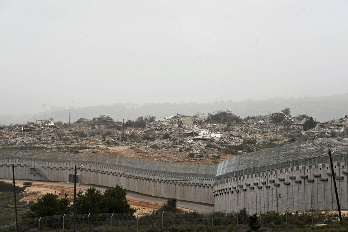 A destroyed settlement in southern Lebanon is seen from the village of Alamsha in northern Israel, across the border fence on April 20, 2026. Although Israeli forces and pro-Iranian Hezbollah have tem ...