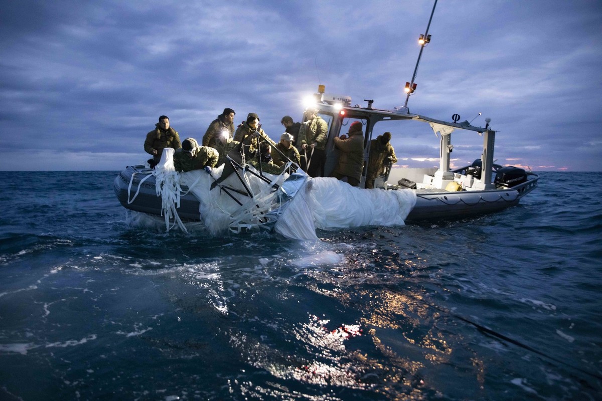 Feb 5, 2023 - Atlantic Ocean, USA - Sailors assigned to Explosive Ordnance Disposal Group 2 recover a high-altitude surveillance balloon off the coast of Myrtle Beach, South Carolina, Feb. 5, 2023. EO ...