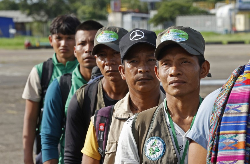 epa10645065 Indigenous people (18 from the Murui and Siona ethnic group, and 7 Coreguajes from Caqueta department) arrive at the San Jose del Guaviare airport to join other indigenous search groups wh ...