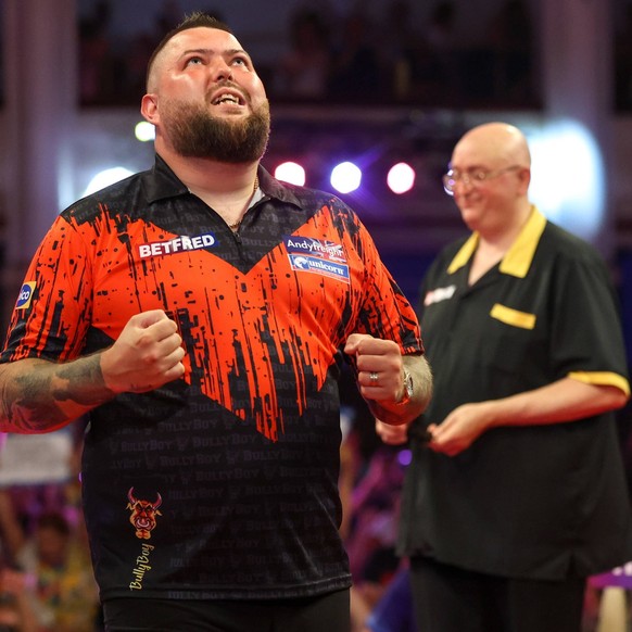 Darts Betfred World Matchplay Michael Smith wins his first round match against Andrew Gilding and celebrates during the 2022 Betfred World Matchplay Darts at Winter Gardens, Blackpool, United Kingdom  ...