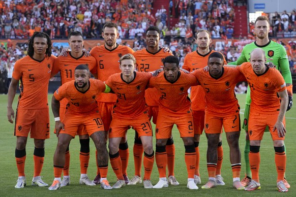 Netherlands&#039; Nathan Ake, Steven Berghuis, Stefan de Vrij, Denzel Dumfries, Daley Blind and goalkeeper Mark Flekken, rear from left, Memphis Depay, Frenkie de Jong, Jurrien Timber, and Davy Klaass ...