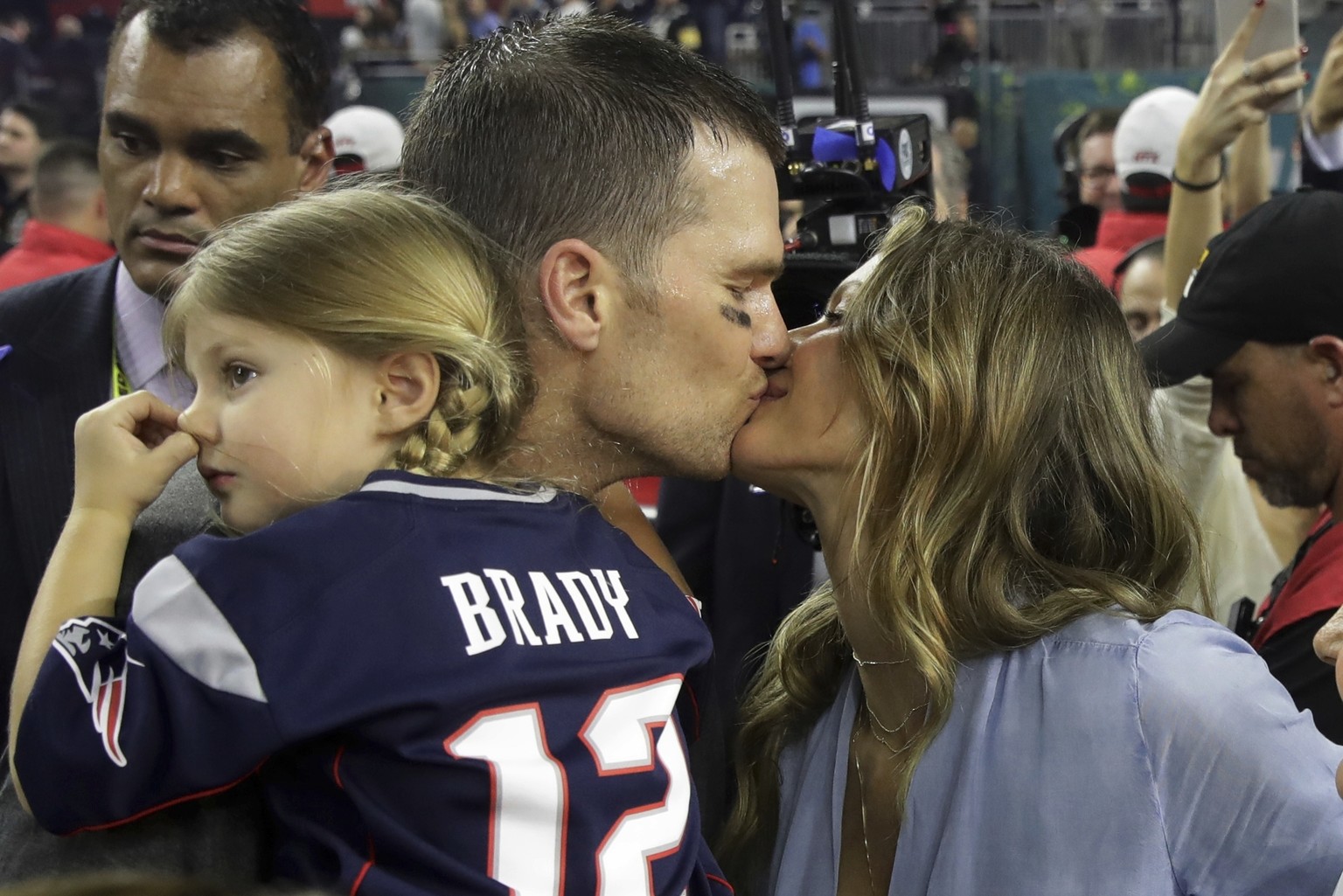New England Patriots&#039; Tom Brady kisses his wife Gisele Bundchen after his team defeated the Atlanta Falcons in overtime at the NFL Super Bowl 51 football game Sunday, Feb. 5, 2017, in Houston. Th ...