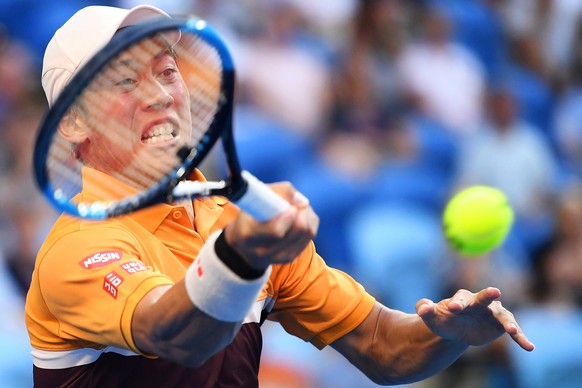epa07305306 Kei Nishikori of Japan in action against Pablo Carreno Busta of Spain during their men's singles fourth round match at the Australian Open Grand Slam tennis tournament in Melbourne, Australia, 21 January 2019.  EPA/JULIAN SMITH AUSTRALIA AND NEW ZEALAND OUT