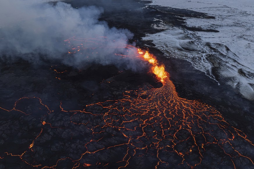 A close up of the Southern active segment of the original fissure of an active volcano in Grindavik on Iceland&#039;s Reykjanes Peninsula, Tuesday, Dec. 19, 2023. (AP Photo/Marco Di Marco)