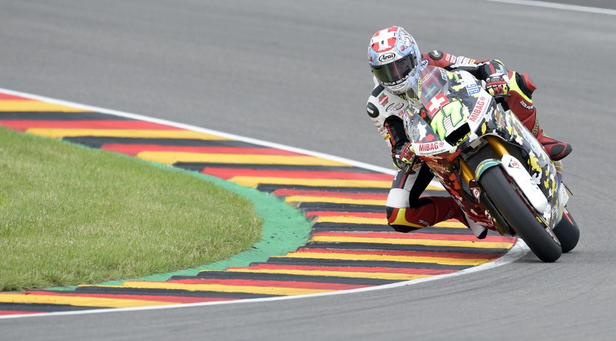 Moto 2 rider Dominique Aegerter of Switzerland takes a curve during the German Motorcycle Grand Prix at the Sachsenring circuit in Hohenstein-Ernstthal, Germany, Sunday, July 2, 2017. (AP Photo/Jens M ...