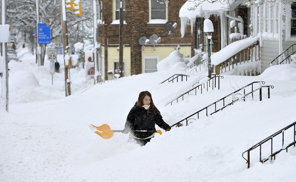 Rochelle Carlotti, 28, shovels steps near her home after a record snowfall on Tuesday, Dec. 26, 2017, in Erie, Pa. The National Weather Service office in Cleveland says Monday&#039;s storm brought 34  ...