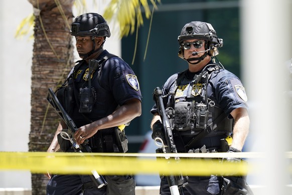 Armed federal agents patrol at the Wilkie D. Ferguson Jr. U.S. Courthouse, Tuesday, June 13, 2023, in Miami, before former President Donald Trump is makes a federal court appearance on dozens of felon ...