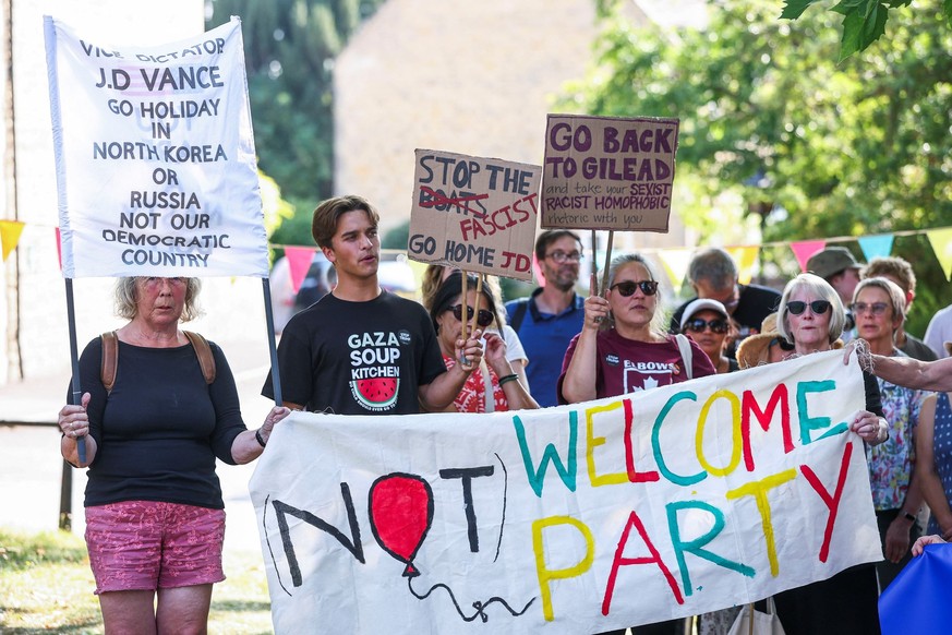 People attend the &quot;Vance not welcome party&quot; protest, organised by Everybody Hates Elon and Stop Trump Coalition, as U.S. Vice President JD Vance spends his holiday nearby, in Charlbury, Cots ...
