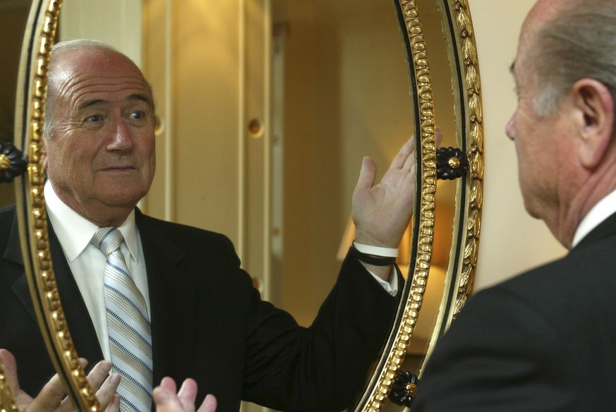 FILE - In this Thursday Sept. 1, 2005 file photo Sepp Blatter, FIFA President, poses for a photo at A Hotel in west London. FIFA President Sepp Blatter said Tuesday June 2, 2015, that he will resign f ...