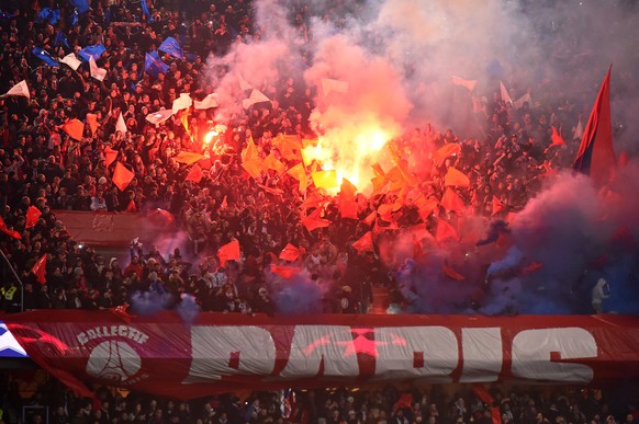 epa06585604 PSG&#039; fans cheer for their team and light flares during the UEFA Champions League round of 16 second leg soccer match between Paris Saint Germain (PSG) and Real Madrid in Paris, France ...