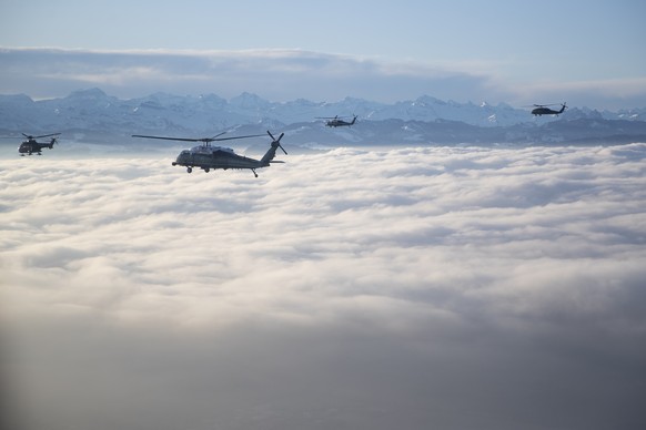 Marine One carrying US President Donald Trump travels to the Davos landing zone in Switzerland, Tuesday, Jan. 21, 2020. President Trump arrived in Switzerland on Tuesday to start a two-day visit to th ...