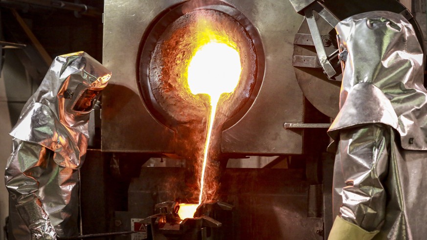 epa09399773 Kumtor Gold Company CJSC workers run a furnace with molten gold on the gold recovery plant at the Kumtor gold mine, where ore crushed and delivered to the mill than the gold is extracted u ...