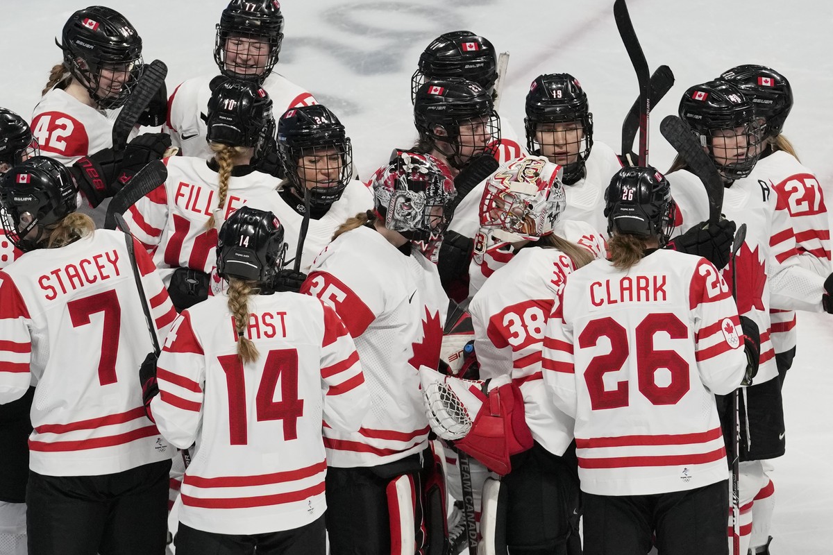 Team Canada celebrates after a 10-3 win over Switzerland in a women's semifinal hockey game at the 2022 Winter Olympics, Monday, Feb. 14, 2022, in Beijing. (AP Photo/Petr David Josek)
