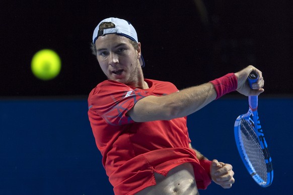 Germany&#039;s Jan-Lennard Struff returns a ball to Australia&#039;s John Millman during their first round match at the Swiss Indoors tennis tournament at the St. Jakobshalle in Basel, Switzerland, on ...