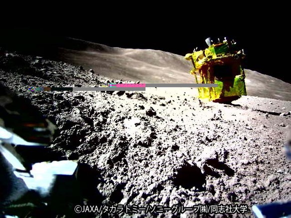 epa11103563 A handout photo made available by JAXA and taken by Lunar Excursion Vehicle (LEV-2) shows Japan Aerospace Exploration Agency&#039;s SLIM (Smart Lander for Investigating Moon) on the Moon s ...