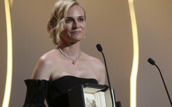 Actress Diane Kruger with her Best Actress award for her role in the film In The Fade poses for photographers during the awards ceremony at the 70th international film festival, Cannes, southern Franc ...
