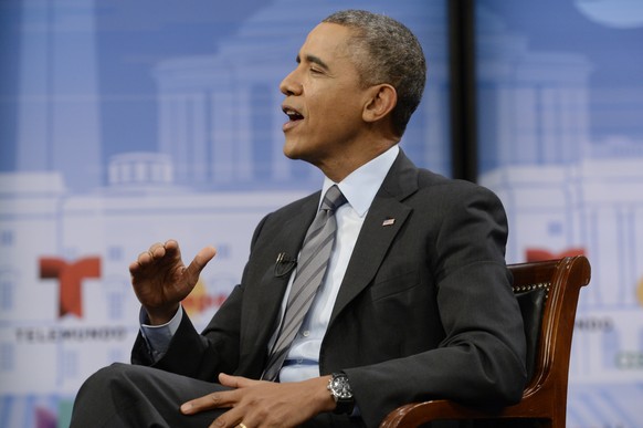 WASHINGTON, DC - MARCH 6: US President Barack Obama participates in a town hall event on affordable health insurance, at the Newseum on March 6, 2014 in Washington, D.C. Obama discussed how the Afford ...